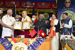 The Dalai Lama being given Gadnhi-Mandela Award  by HP Guv in Mac Loed Ganji 