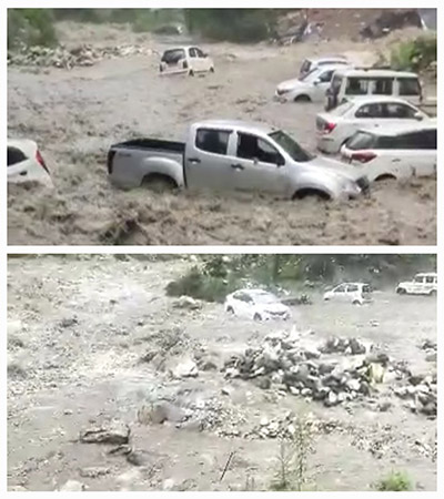 The cars parked near Kasol are seen washed away in the surging Kasol nala in Parbati valley 