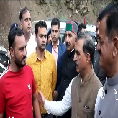 CM Suku with tourists in Kullu after they were evacuated on July 12