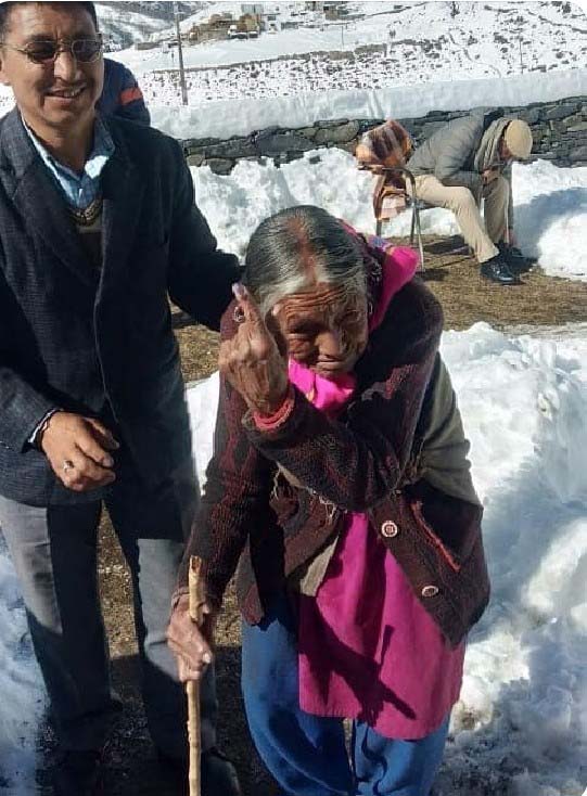 An Old woman voter, CEO, Tripura election icon  urging people to Vote 