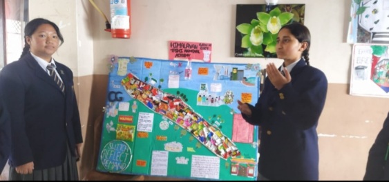 Palampur school girls  present model of the canal littered by plastic 