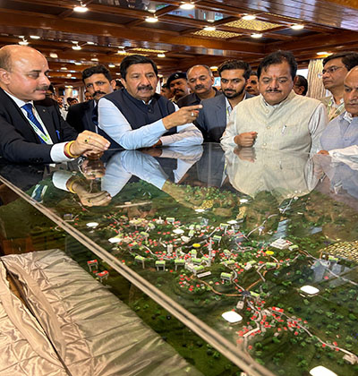 DptCM Agnihotri with officials at the Ropeway Model in Shimla ibari with Jhakhu hills in  the backdrop 