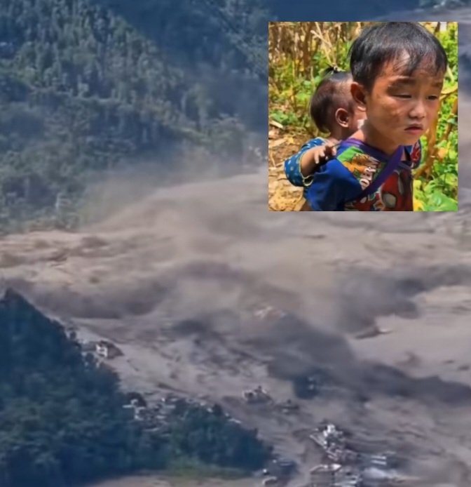 NepaliChildLookingAtTheSurgingTrishiliFloods