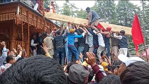 The Devotees putting the Kurud at the temple top of Lankravir in Chopal in May 3, 2022
